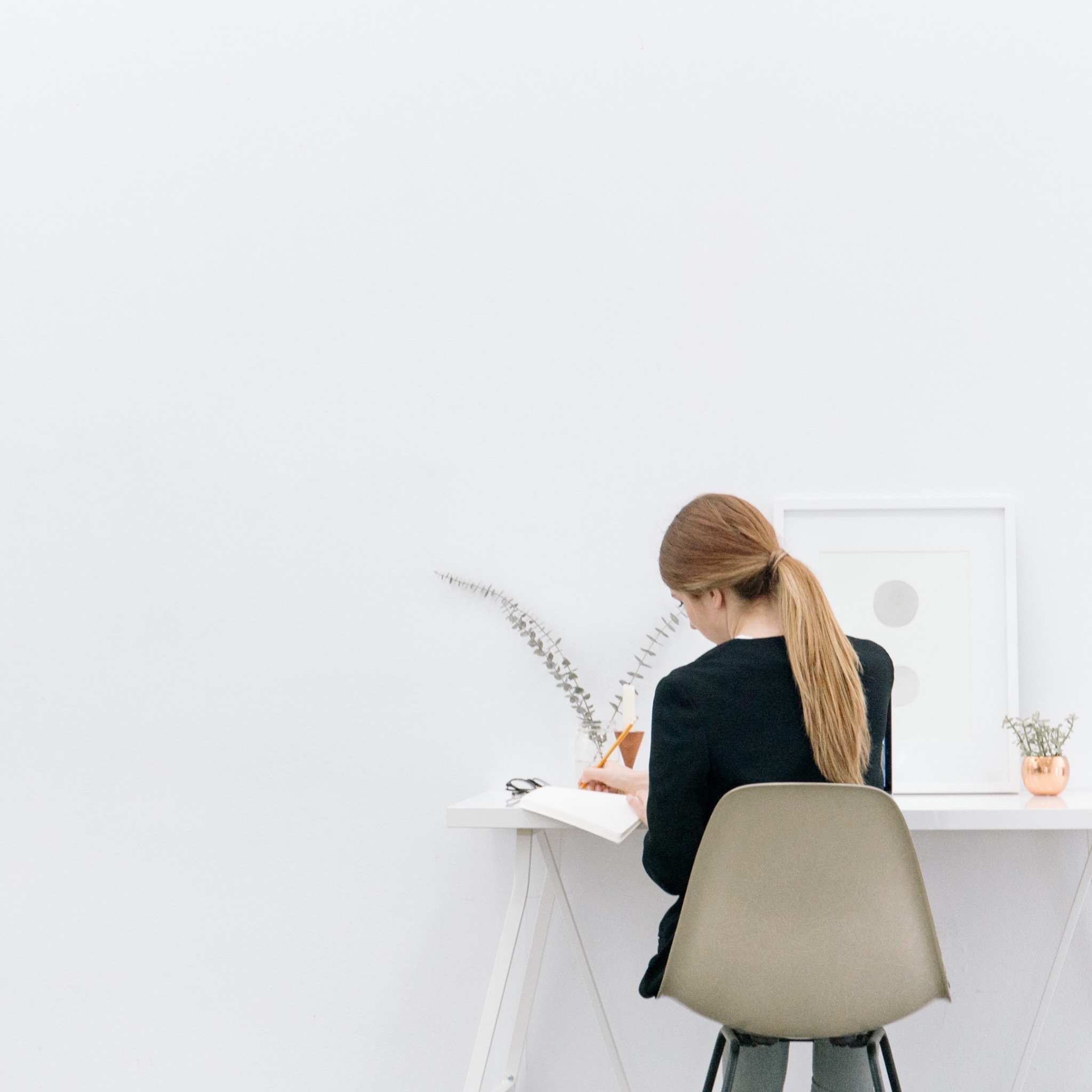 a lady sitting at a home office