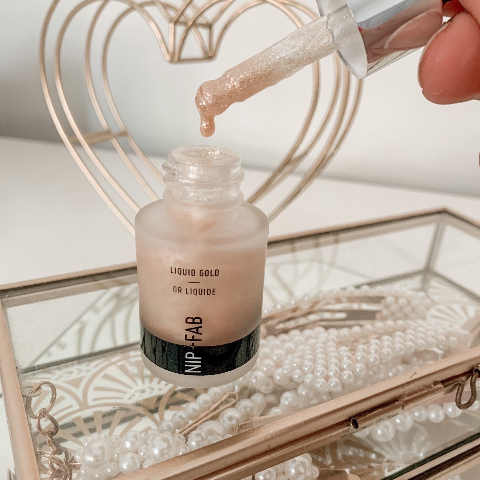 a small bottle of beige coloured high lighter liquid