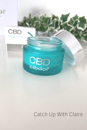 A pot of cibdol CBD eye cream opened showing the cream inside