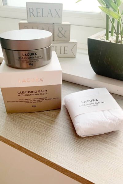 a box of the Lacura Cleansing Balm with the cleansing cloth next to it