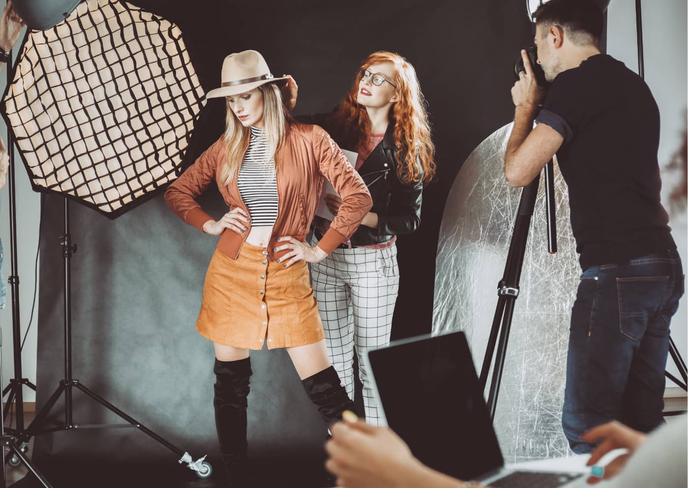 a model at a photoshoot practising her poses