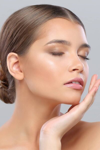 a close up of an attractive lady's face with perfect foundation