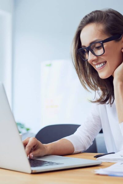 a lady working from home on her laptop now feeling less stressed