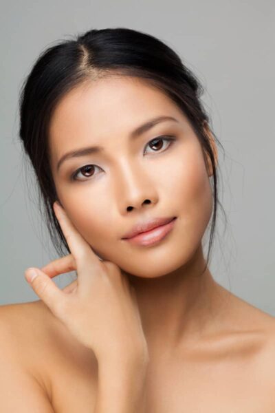 a close up a ladies face with a clear complexion and clearer skin
